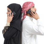 Muslim man and woman talking on a chatline