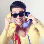 Gay Phone Sex Line Operator With Colorful Handsets