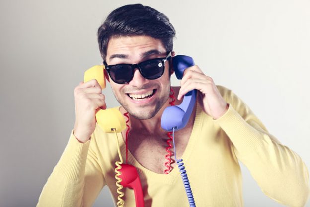 Gay Phone Sex Line Operator With Colorful Handsets